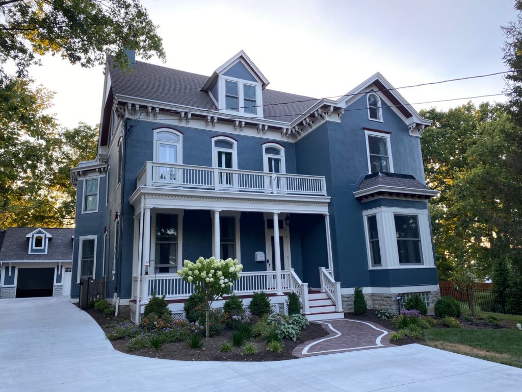 Slate blue gray house with white and rd trim
